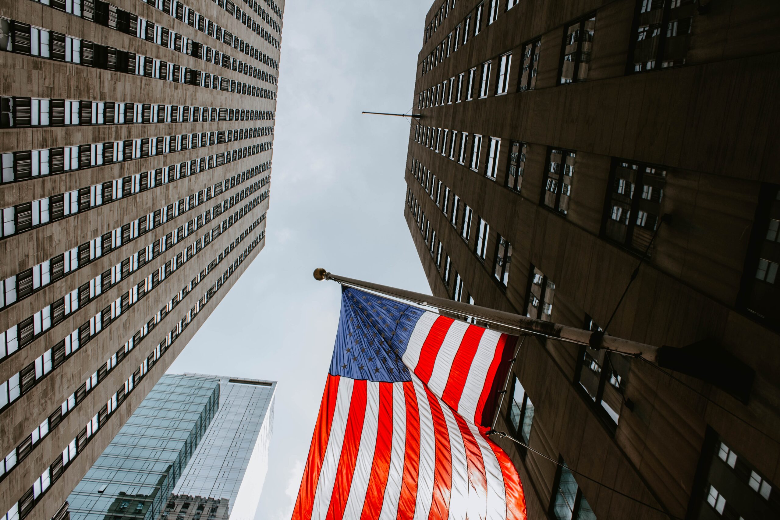 MANHATTAN, UNITED STATES - Aug 14, 2018: The US flags fluttering from a Manhattan building.